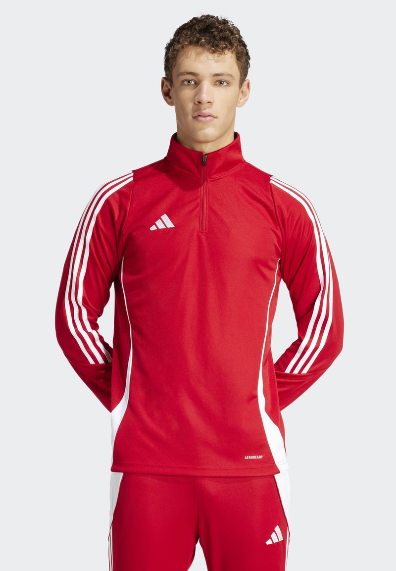 Red athletic zip-up shirt with white stripe accents, long sleeves, and adidas logo. Made from smooth, breathable material for comfort.