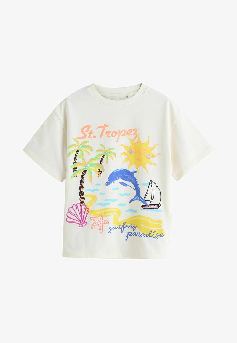 White cotton t-shirt featuring colorful beach-themed graphics: palm trees, a dolphin, a sun, and a sailboat, with the text "St. Tropez" and "surfers paradise."