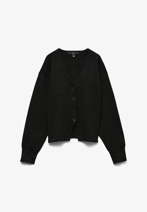 Zwarte gebreide cardigan met een V-hals, drop shoulders en lange mouwen. Voorzien van zes knopen aan de voorkant en een iets verkorte zoom.