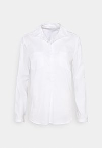 Camicia bianca a maniche lunghe realizzata in tessuto leggero. Presenta un colletto a punta, due tasche sul petto e polsini con bottone. Texture liscia.
