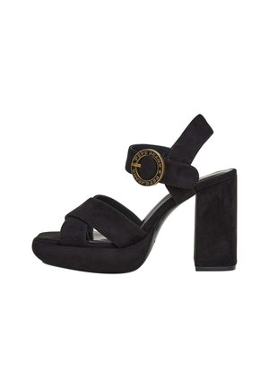 Black suede high-heeled sandal with platform sole, crossed front straps, ankle strap featuring a round gold buckle with "Pepe Jeans" text.