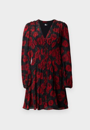 Robe noire avec un motif floral de roses rouges, manches longues, décolleté en V et détails à boutons sur le devant. Tissu léger.