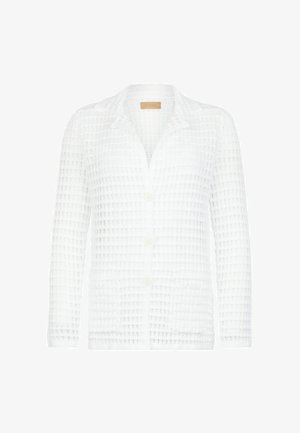 Cardigan bianco con maniche lunghe, bottoni, texture a maglia waffle e colletto a risvolto.