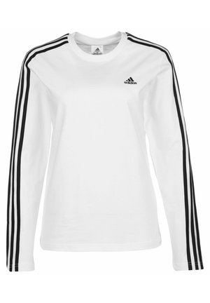 T-shirt blanc Adidas à manches longues avec détail des trois bandes noires sur les manches et petit logo Adidas noir sur le côté gauche de la poitrine.