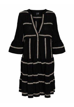 Black dress with V-neckline, decorative white embroidery accents, bell sleeves, and tiered ruffle hem. Made of lightweight fabric.