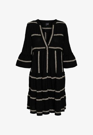 Black dress with V-neckline, decorative white embroidery accents, bell sleeves, and tiered ruffle hem. Made of lightweight fabric.