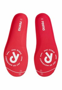 Paire de semelles rouges Reima avec logos blancs, taille 32, et le texte "Joy of Movement Since 1944" imprimé sur chacune.