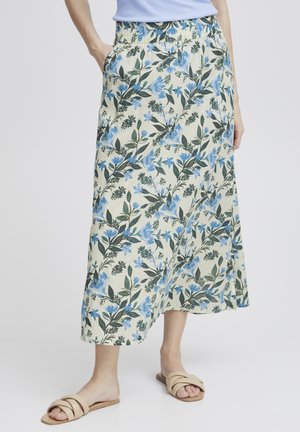 Gonna maxy floreale con sfondo beige chiaro, foglie verdi e fiori blu. Presenta una vita elasticizzata e tasche laterali.
