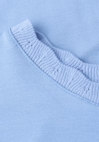 Light blue knitted fabric with a close-up of a folded, ribbed collar section showing detailed stitching and texture.