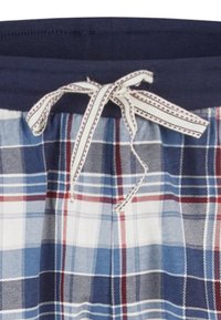 Blauw, wit en rood geruit stof met een marineblauwe tailleband en een witte trekkoord met rode stiksels.