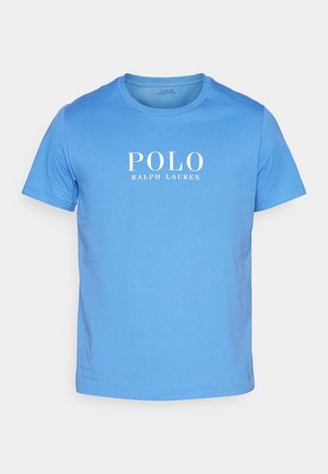 T-shirt in cotone azzurro chiaro con girocollo, maniche corte e logo bianco "POLO RALPH LAUREN" sulla parte frontale. Texture morbida.