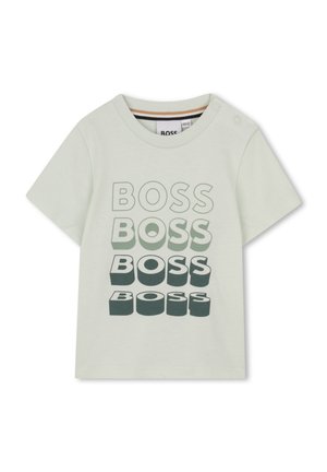Light green toddler t-shirt with short sleeves and four stacked gradient "BOSS" text designs on the front, button snaps on shoulder.