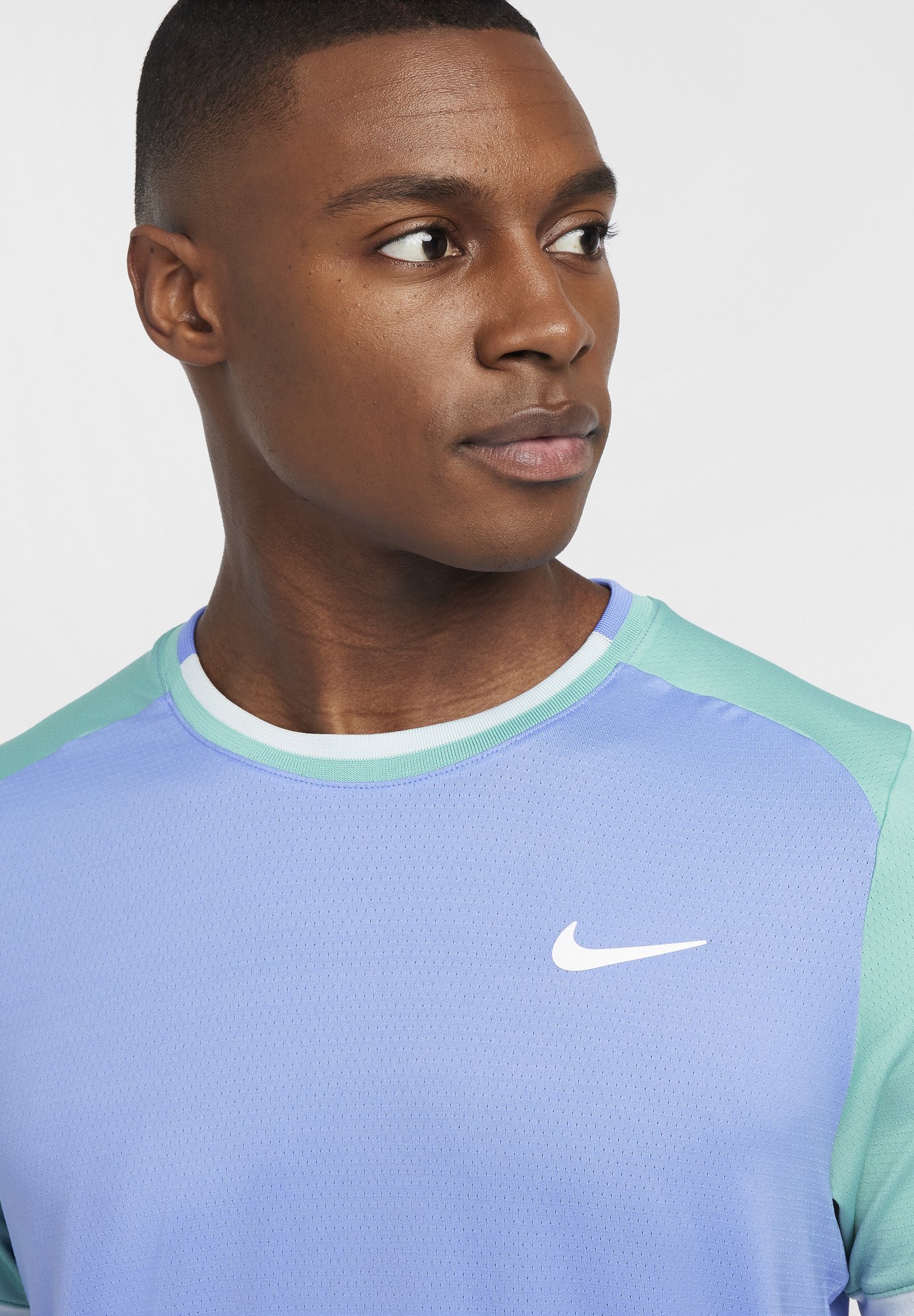 green and purple nike shirt