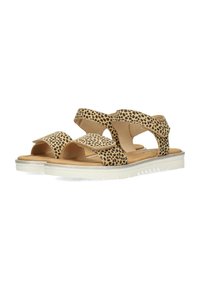 Sandali beige con un motivo a macchie nere, dotati di due cinturini regolabili, una soletta imbottita e una suola in gomma bianca con un design testurizzato.