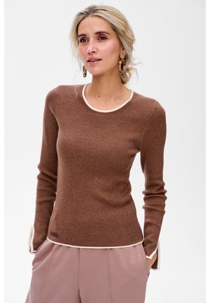 - Sweter