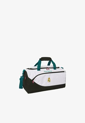 Biało-czarna sportowa torba typu duffel Real Madrid z turkusowymi uchwytami i paskiem na ramię, z logo z przodu i zamykanymi na zamek komorami.