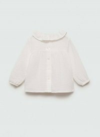 Valkoinen pitkähihaista paitaa, jossa on röyhelökaulus, teksturoitu kangas ja napitus edessä. Rentomallinen, jossa on kokoontunut vyötärödetail.