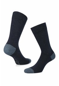 Ciemnoniebieskie skarpetki z prążkowanym mankietem, z jasnoniebieskimi akcentami na pięcie i palcach. Wykonane z miękkiego, teksturowanego materiału dla większego komfortu.