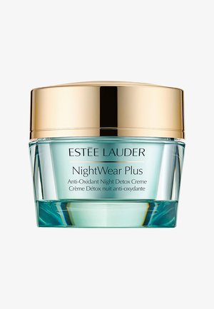 Pot en verre vert avec un couvercle doré, étiqueté "ESTÉE LAUDER NightWear Plus Crème Détox Anti-Oxydante Nuit." Surface lisse, design minimaliste.