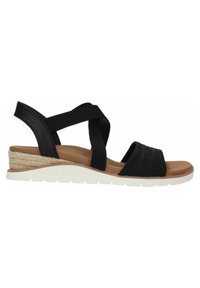 Las sandalias negras de cuña cuentan con correas elásticas y un detalle trenzado, con una plantilla acolchada beige y una suela de goma blanca con envoltura de yute.