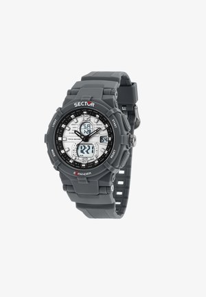 Orologio digitale grigio con cassa rotonda, cinturino in gomma e molteplici display. Caratteristiche includono un quadrante argentato con dettagli neri e pulsanti.