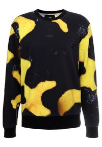 Sudadera negra con formas abstractas amarillas y un pequeño logo negro. Tiene mangas largas y un cuello redondo, fabricada con un tejido suave.