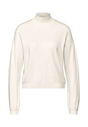Pull à col montant couleur crème avec de longues manches amples et un ourlet ajusté. Fabriqué en tissu doux avec une texture lisse.