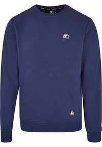 Mørkeblå sweatshirt med rund hals, lange ærmer, ribbede cuff og kant. Har et lille hvidt logo på brystet og branding på mærket.