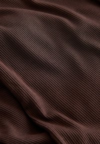 Brown ribbed fabric with a soft texture, featuring subtle vertical lines and gentle draping. The color is deep and uniform.