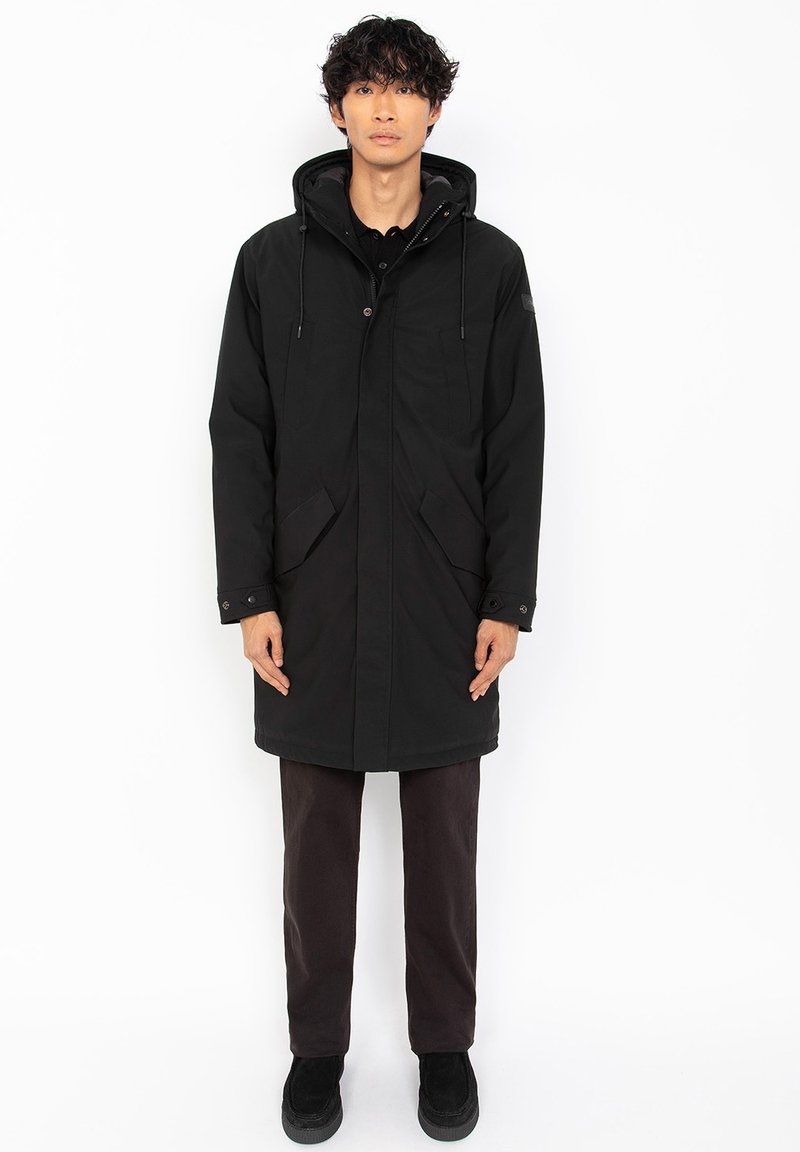 Schwarzer, kapuzenparka mit Knopfverschluss, zwei Fronttaschen und elastischen Bündchen. Das Material wirkt glatt und strapazierfähig, mit einer lässigen Passform.