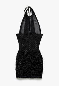 Robe noire à col halter avec un design froncé, ornée de points argentés scintillants. Le tissu est extensible, avec un détail en arrière transparent pour plus de texture.