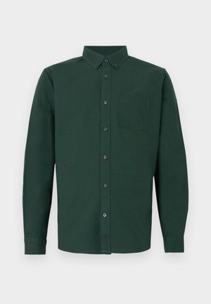 Camicia verde scuro a maniche lunghe con bottoni, colletto con bottoni e una tasca sul petto.