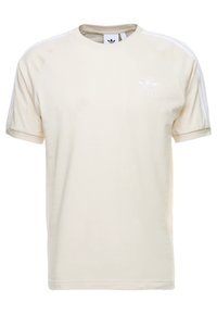 Beige tričko s krátkým rukávem Adidas s bílými třemi pruhy na rukávech a malým logem trefoil na levé hrudi.