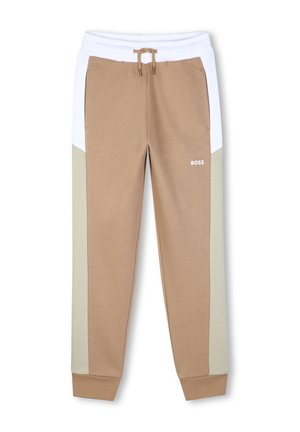 Pantalon de jogging beige avec panneaux latéraux blancs et beige clair, taille élastique avec cordon de serrage et logo BOSS sur la cuisse droite.
