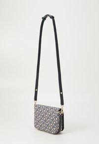 Tommy Hilfiger FLAP CROSSOVER - Handbag - space blue