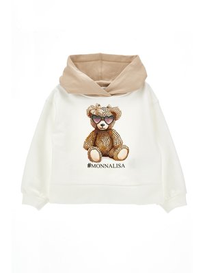 Felpa bianca con cappuccio beige caratterizzata da un design di un orsetto marrone con dettagli in cristallo e l'hashtag "#MONNALISA" in fondo.