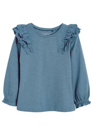 Chemise bleue à manches longues pour tout-petit avec volants en dentelle ajourée aux épaules et poignets élastiques, col rond, en tissu doux.