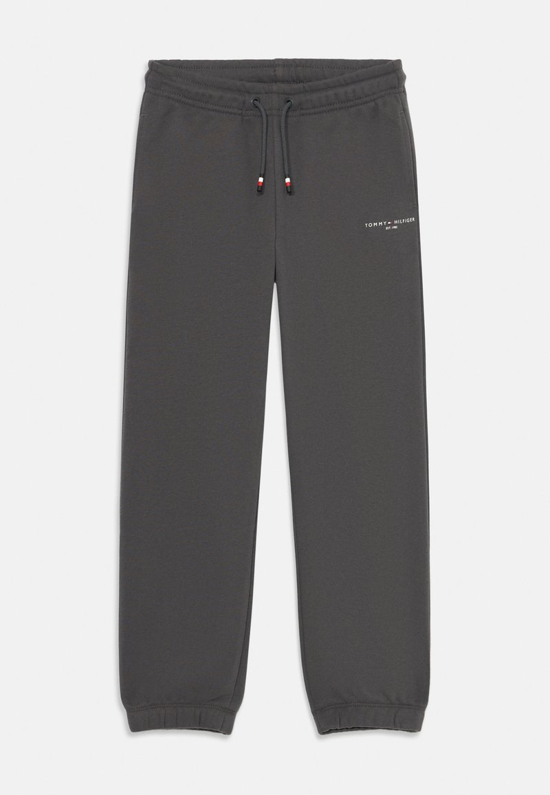 Pantaloni de trening gri dintr-un material moale, cu o talie elastică și șnur, picioare conice și un mic logo în față.