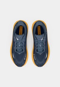 Blue running shoes with a textured upper, orange outsole, and black accents. Features include a cushioned tongue and laces.