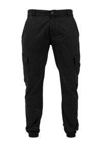 Pantalon cargo noir en tissu résistant. Comprend plusieurs poches latérales, des poignets élastiques, et une coupe classique avec une fermeture à bouton.