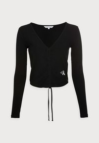 Black ribbed long-sleeve top with a V-neck, featuring a front closure and drawstring at the waist. Small white logo on the left side.