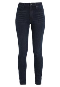 Jeans de denim oscuros de tiro alto, con un diseño ajustado, ligeras marcas de desgaste y un estilo estándar de cinco bolsillos.