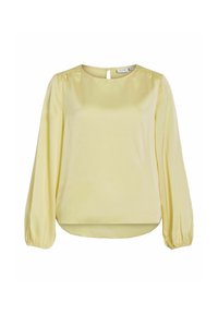 Vaaleankeltainen pitkähihaisen paita, jossa on pyöreä pääntie, kerätty hihansuu ja avainreikäpainike takana.