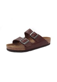 Sandalias de cuero marrón con dos correas ajustables, hebillas de plata, plantilla de corcho y suela de goma texturizada, diseñadas para la comodidad.