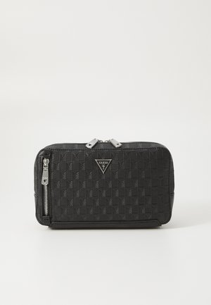 Black quilted wallet with a geometric pattern, featuring silver zippers and hardware, and a logo plaque on the front.