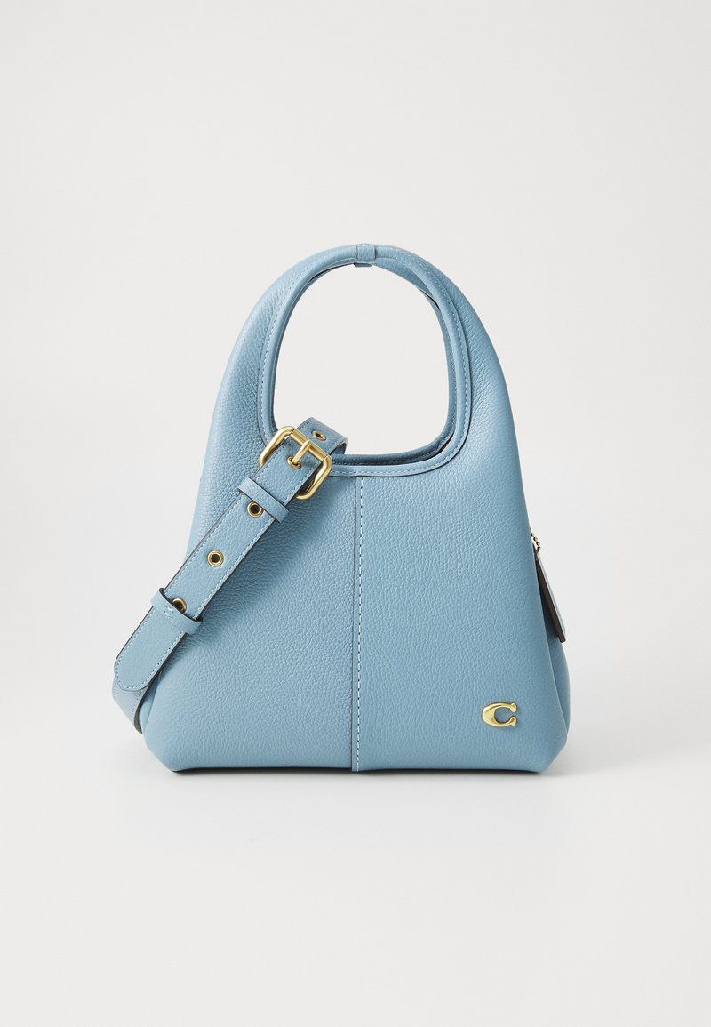 Blue leather handbag with a structured shape, rounded handle, and detachable strap. Features gold hardware and a small logo detail.