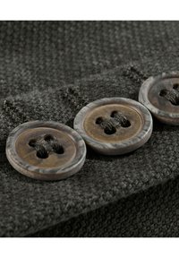 Dark gray fabric featuring three round, marbled buttons with four holes each, stitched securely with black thread along the edge.