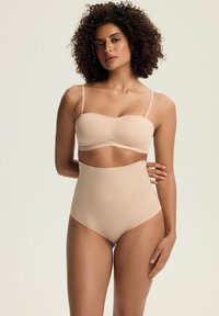 Nude, gładki biustonosz bezszwowy z regulowanymi ramiączkami, w komplecie z wysokim bikini. Miękka tekstura, gładkie wykończenie, minimalistyczny design.