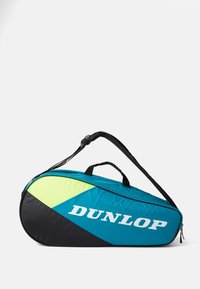 Dunlop-Tennistasche mit einer schlanken ovalen Form. Hergestellt aus türkisfarbenem, schwarzem und fluoreszierend grünem Material, verfügt über einen oberen Griff und einen Schultergurt.