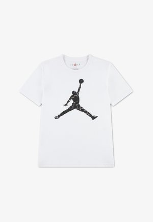 T-shirt blanc avec un logo Jumpman noir représentant la silhouette d'un joueur de basketball sautant, un bras tendu tenant un ballon de basketball.